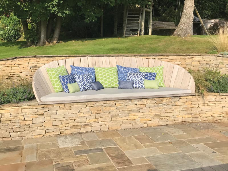 Weatherproof outdoor cushions created for a bespoke outside seating area, featuring a specially shaped seat cushion made from a supplied template.
