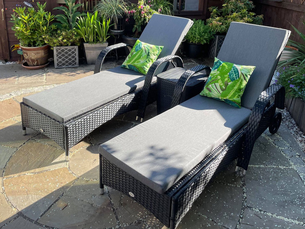 Outdoor cushions for a pair of rattan sun loungers